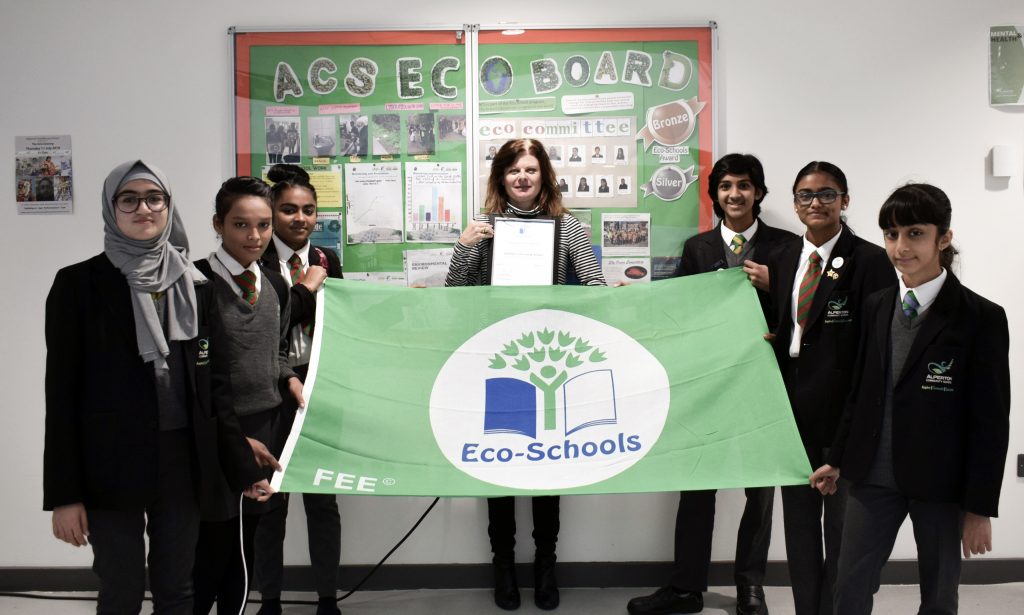 Image of Alperton students holding the Echo-schools flag