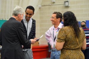 Student being congratulated for his results