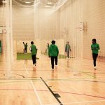 Students taking part in indoor cricket