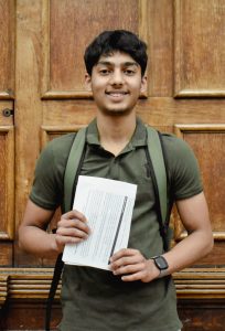 ACS student holding his results