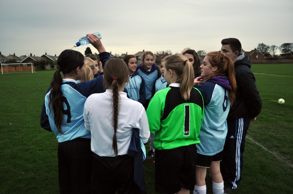 Girls football half time team talk