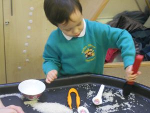 Picking up rice with tweezers, chopsticks and spoons and filling our small bowls