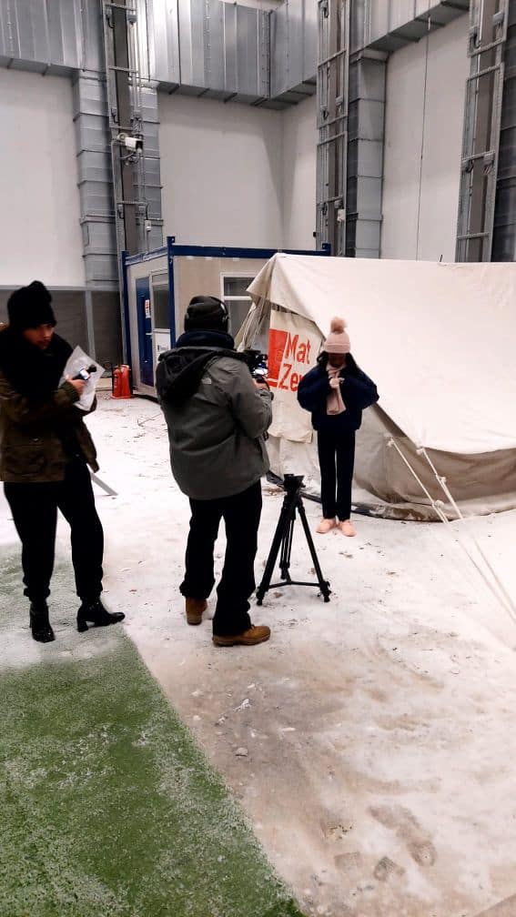 Hazel Grove High School student Iara stands in front of the cameras at Energy House Labs during filming for her feature on Sky Kids FYI weekly news show.