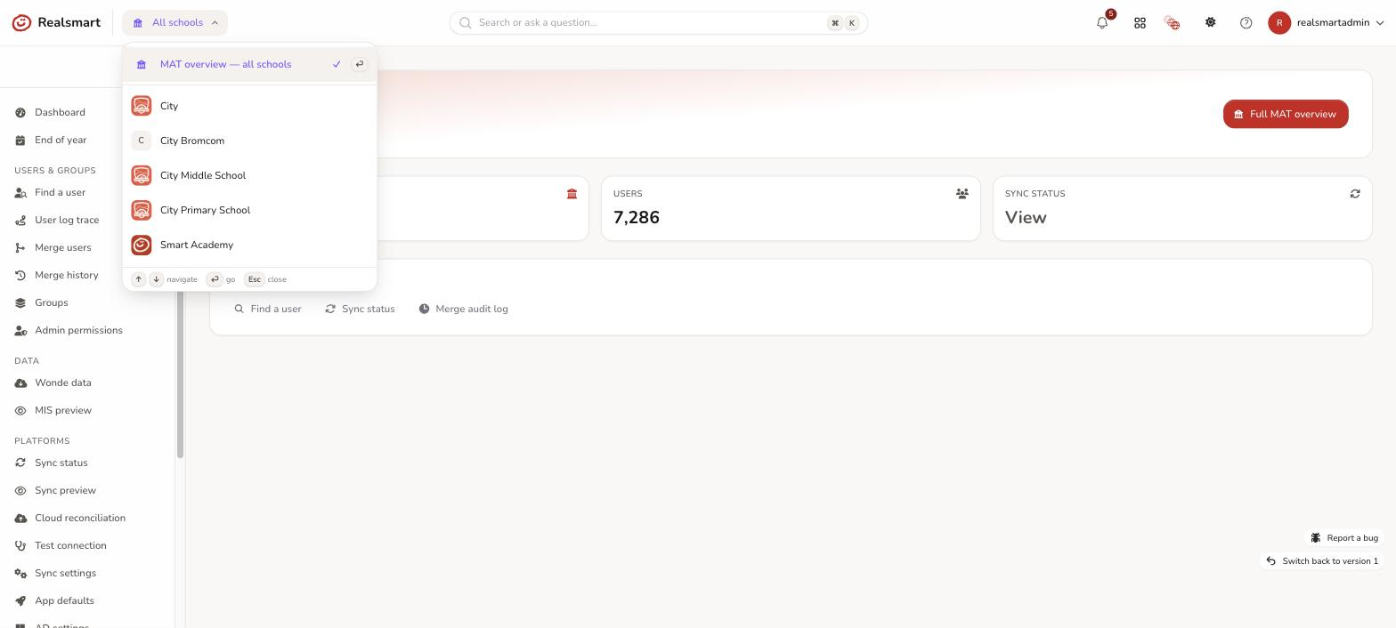 School switcher dropdown open in MAT mode showing the MAT overview all schools option