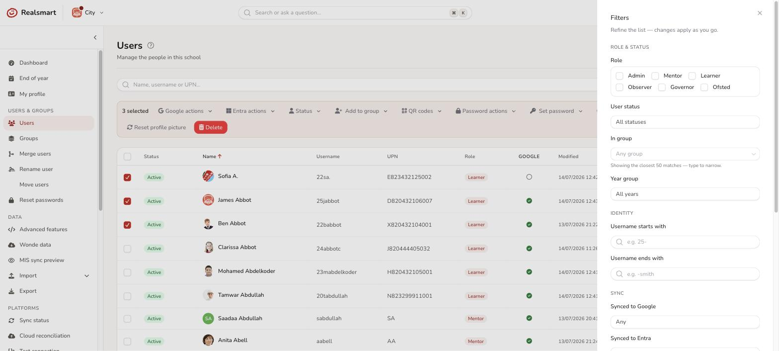 Users filter drawer showing identity and role and status filter groups