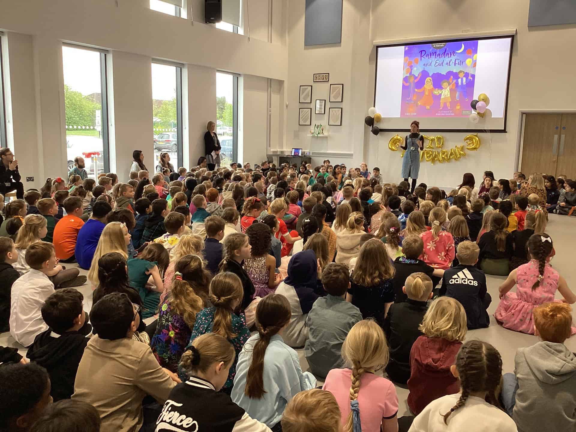 Children sat in Eid assembly
