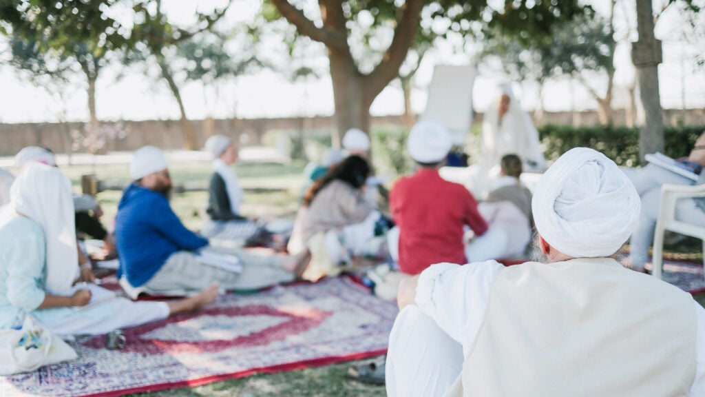 A group of participants learning Yoga techniques during the L2 Kundalini Yoga training course hosted by Miri Piri Academy in Amritsar, Punjab