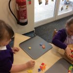 Children playing with alphabet magnets