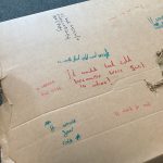 writing on a cardboard box