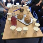 Children sat with items from Judaism