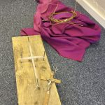 Wooden cross, crucifix, crown of thorns and purple robe