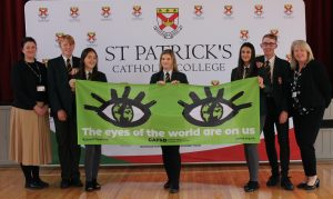 Children from St Patrick’s Catholic College in Thornaby displaying the CAFoD banner alongside head of school Deborah Law and chaplain Alison Fisk