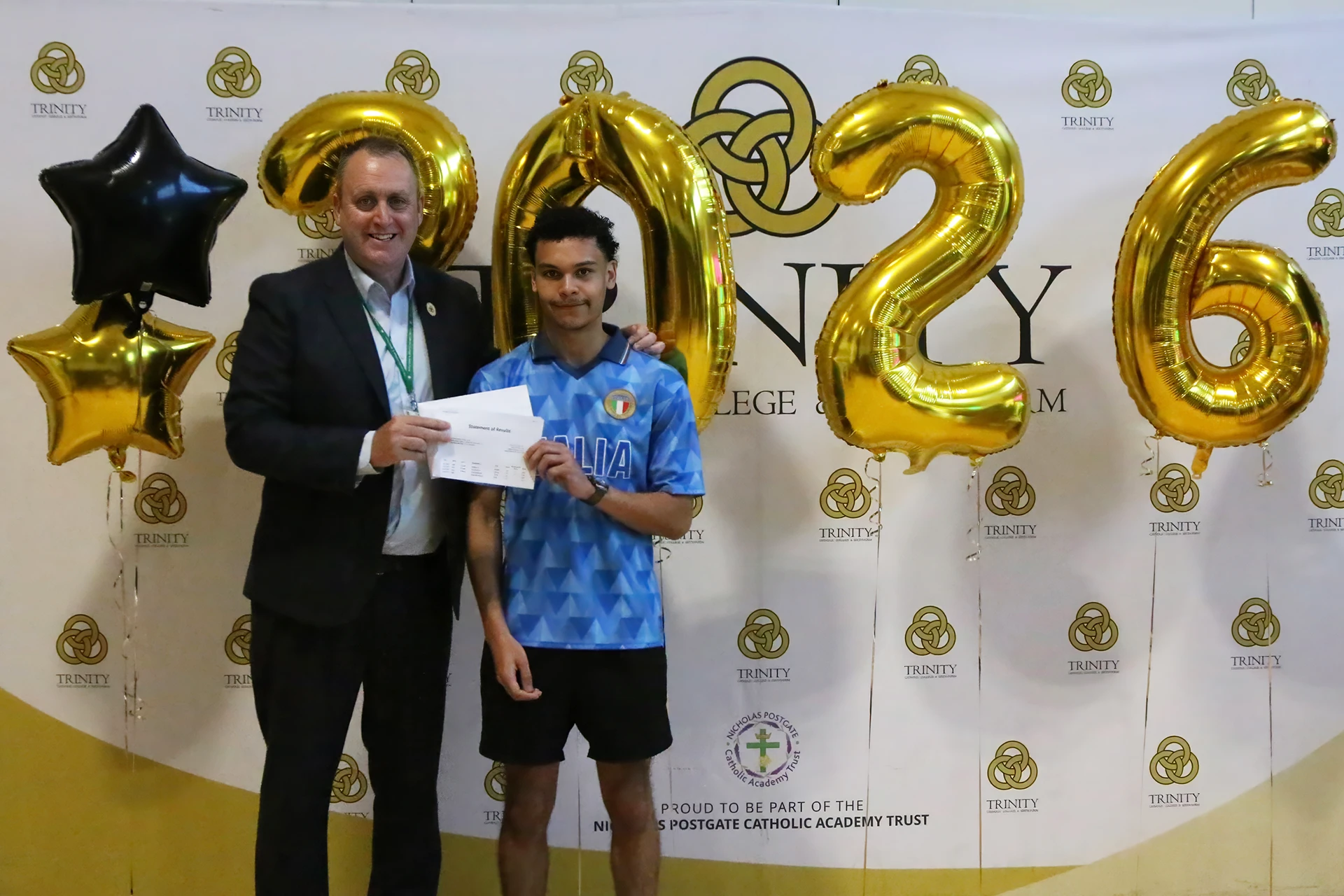 Isaac Diallo pictured with Michael Blair, head of school at Trinity Catholic College