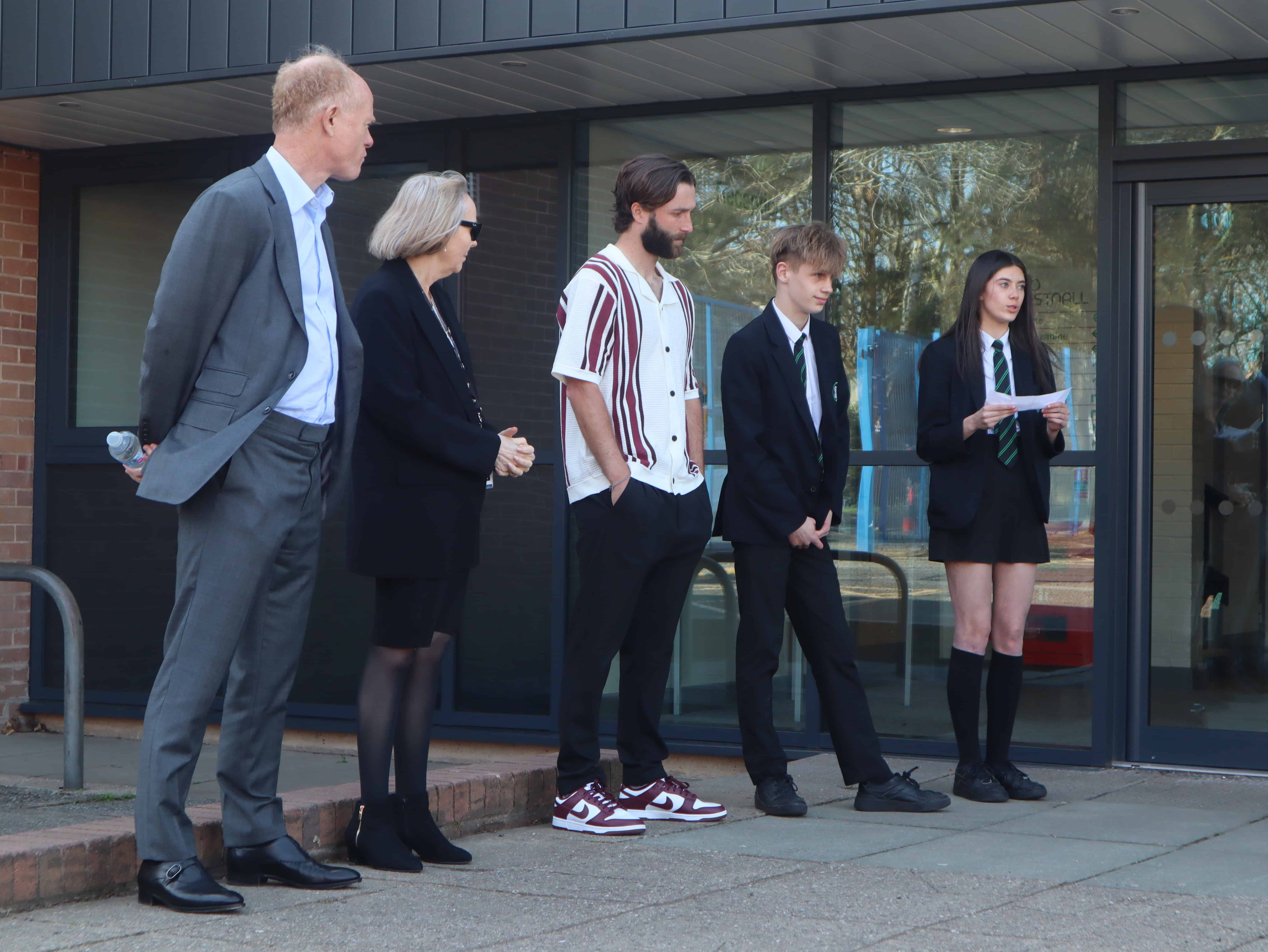 From left to right) Andrew Law, Linda Magrath and Liam Broady stand alongside Priestnall School students Lexi and Tomek as they deliver speeches during the opening ceremony