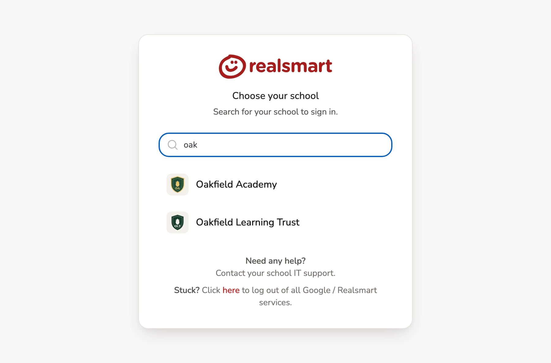 The Realsmart sign-in page asking 'Choose your school', with 'oak' typed in the search box and two matching demo schools listed: Oakfield Academy and Oakfield Learning Trust.