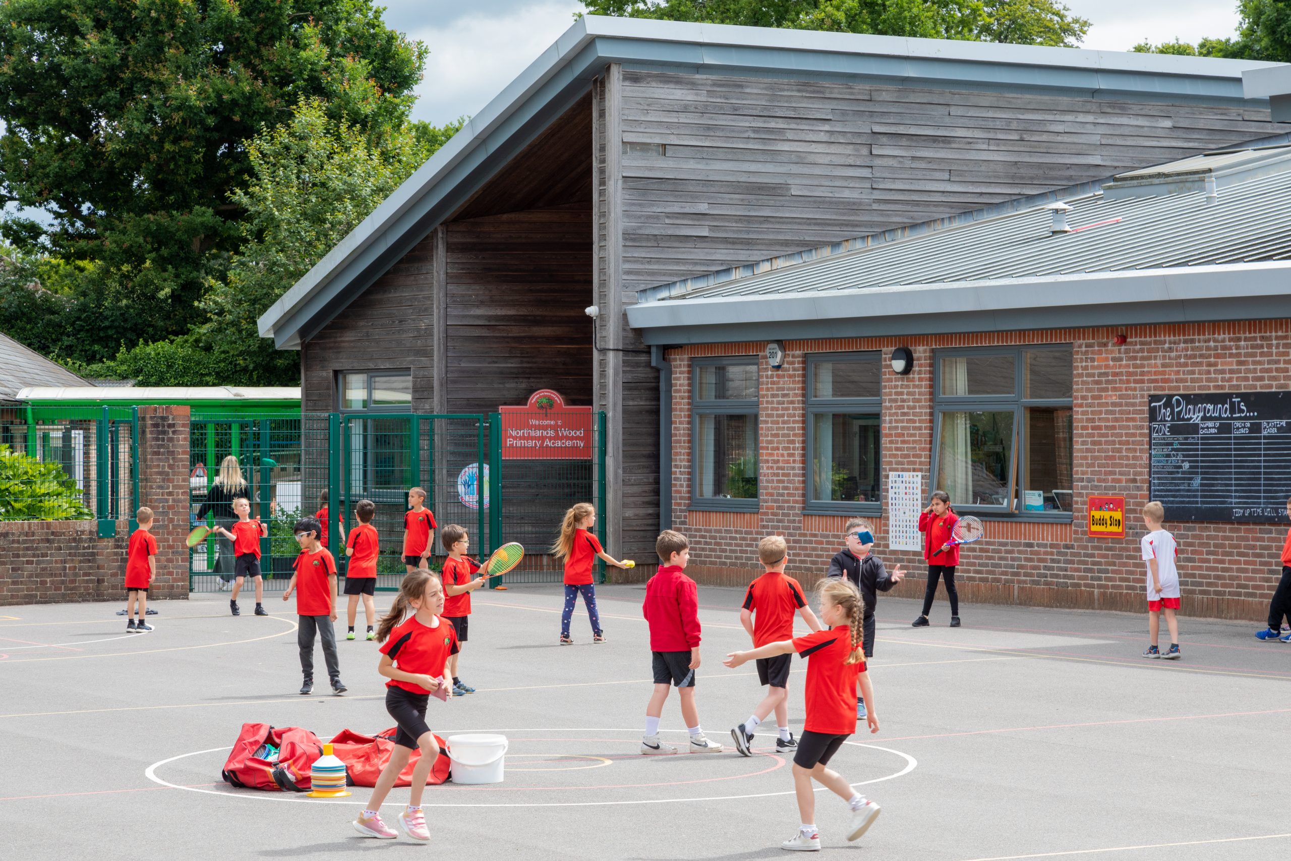 Pupils playing sports on the playground of Northlands Wood Primary Academy