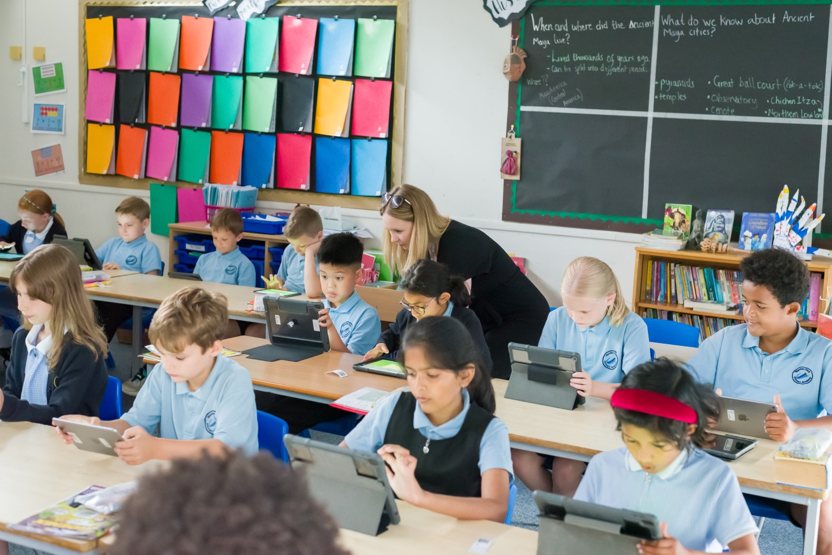 Pupils learning on iPads at Warden Park Primary Academy.