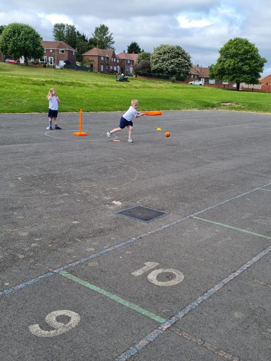 Class 4 playing cricket