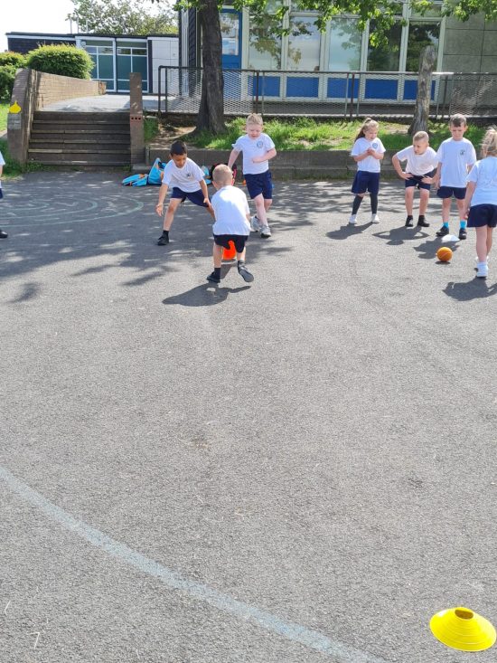Class 4 playing cricket