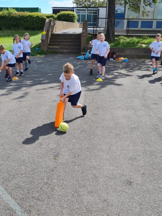 Class 4 playing cricket
