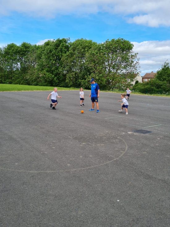 Class 4 playing cricket