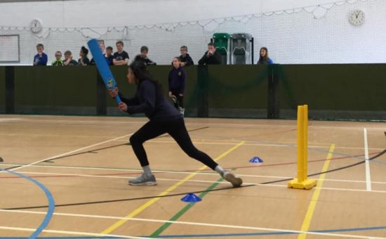 A child steps up to bat at the cricket competition at Castle View