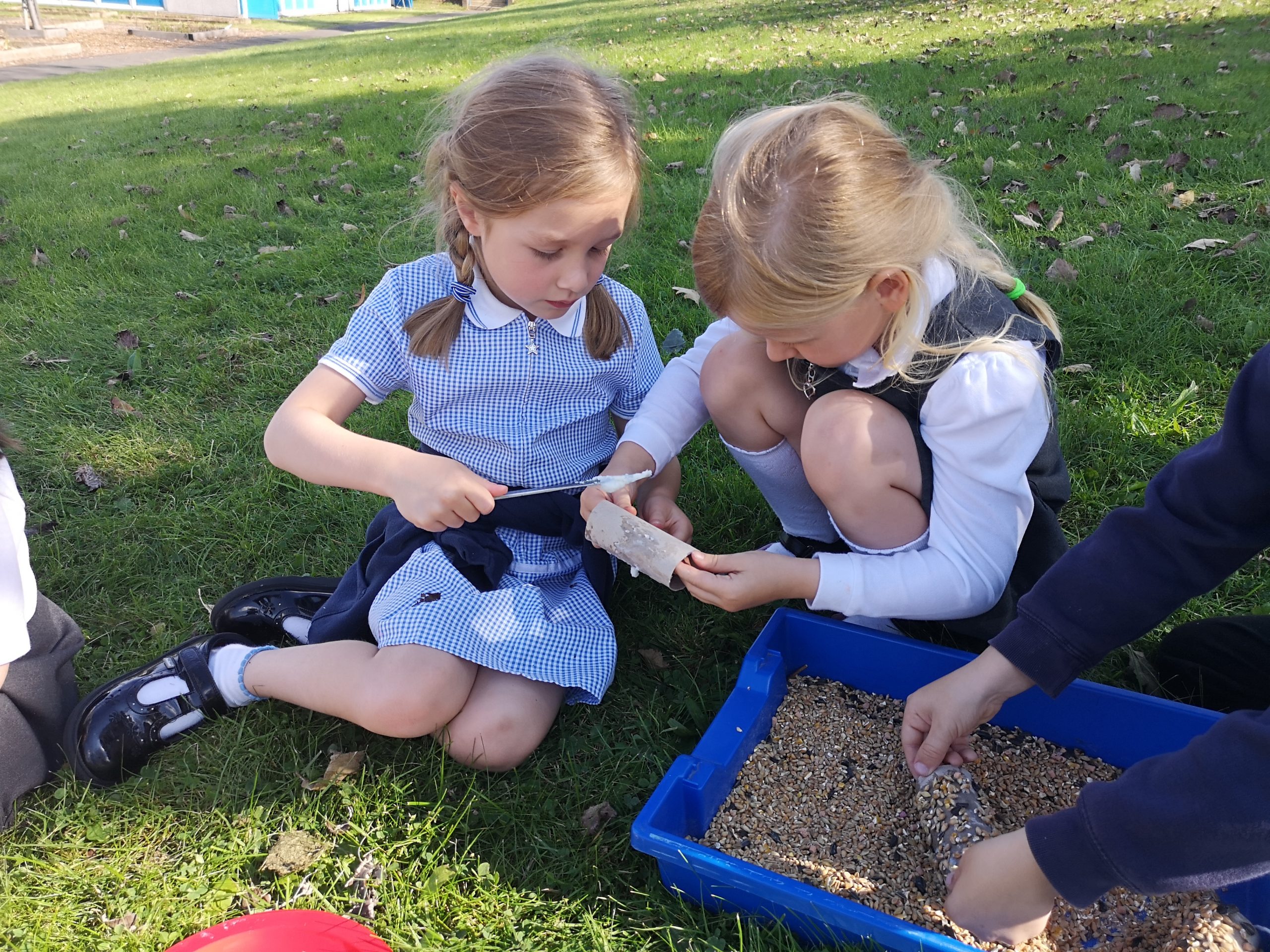 Year 1 children making their bird feeders