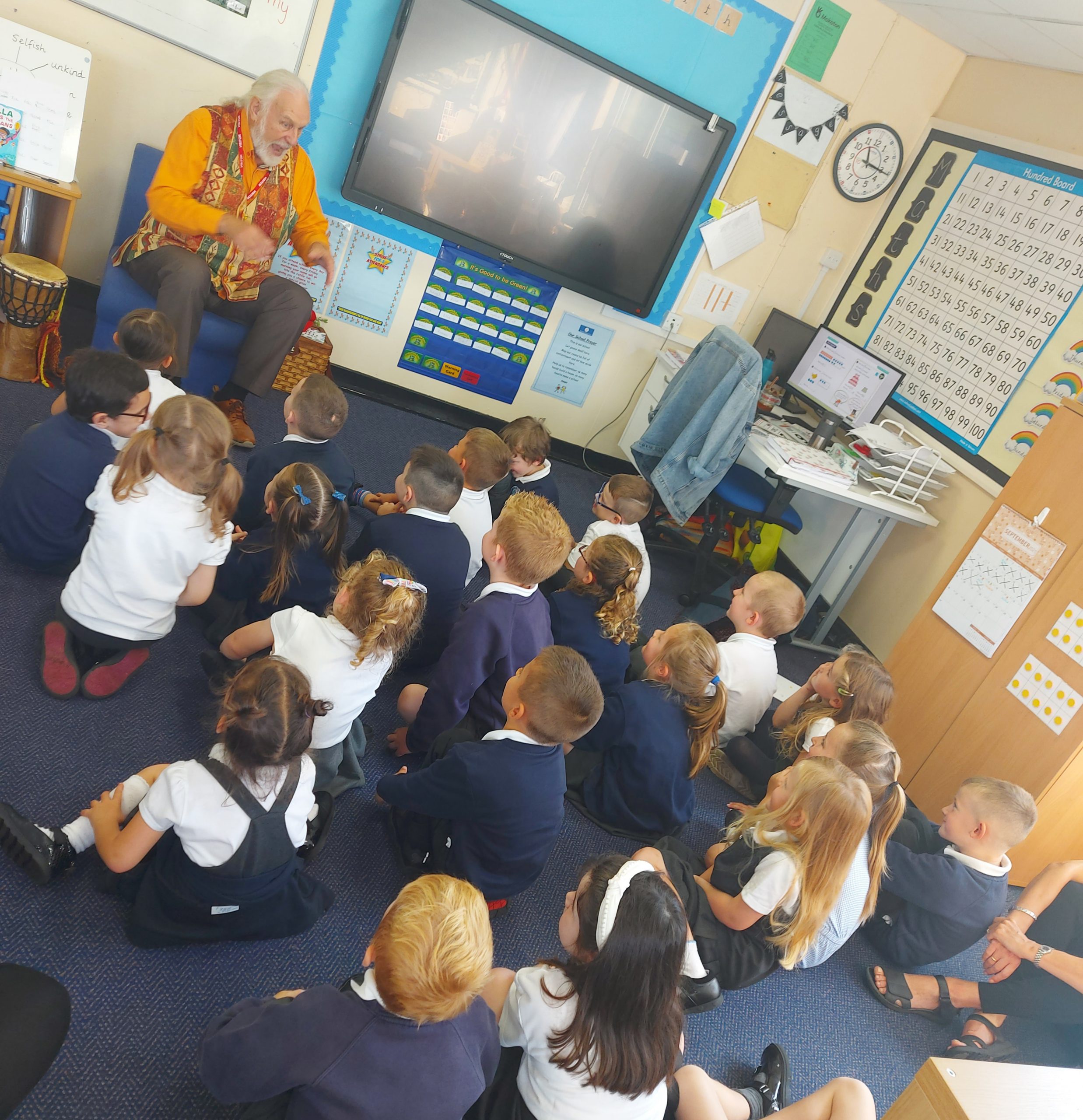Chris Bostock reading stories to the children in Year 1