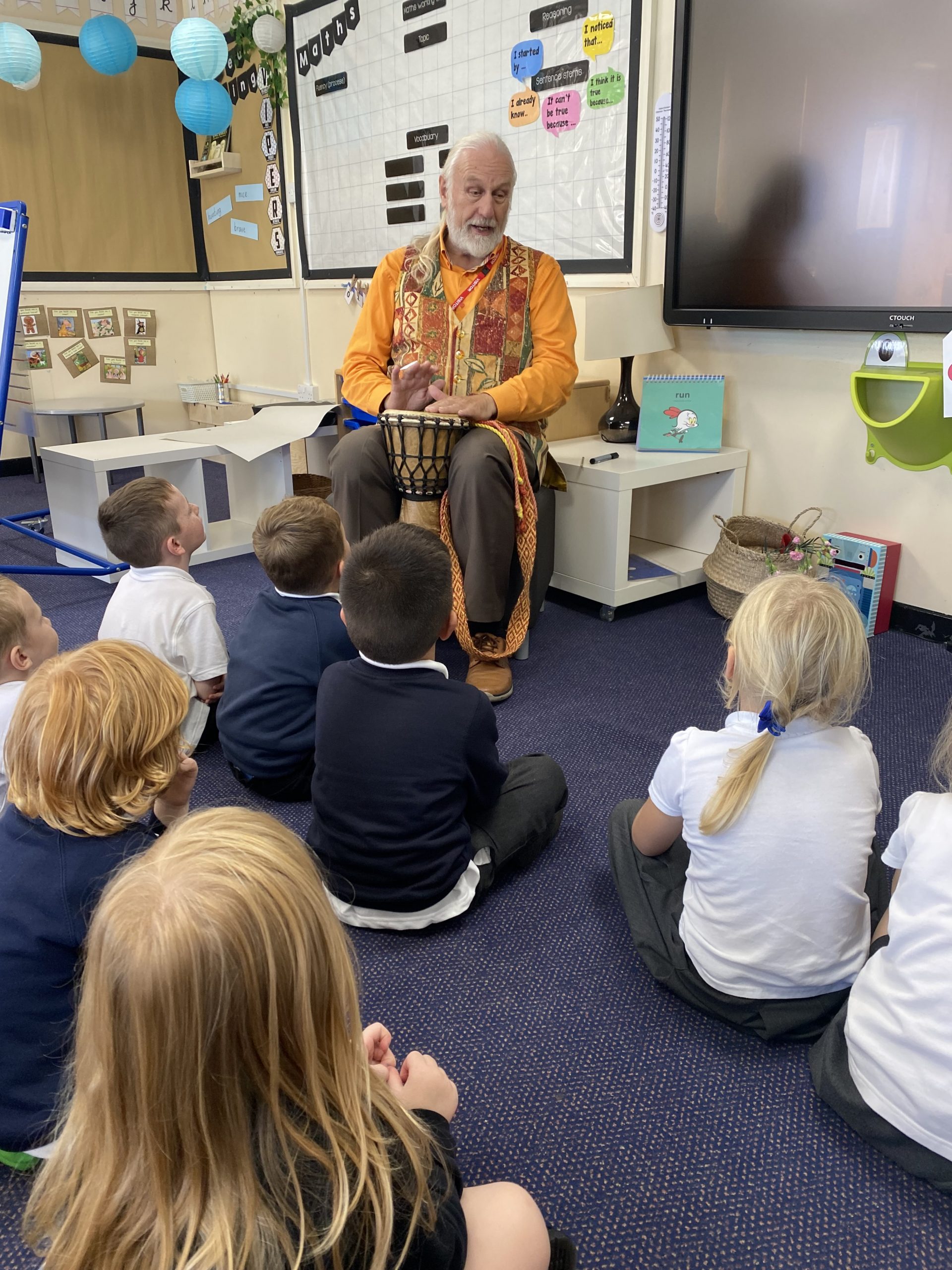 Chris Bostock reading stories to the children in Year 1