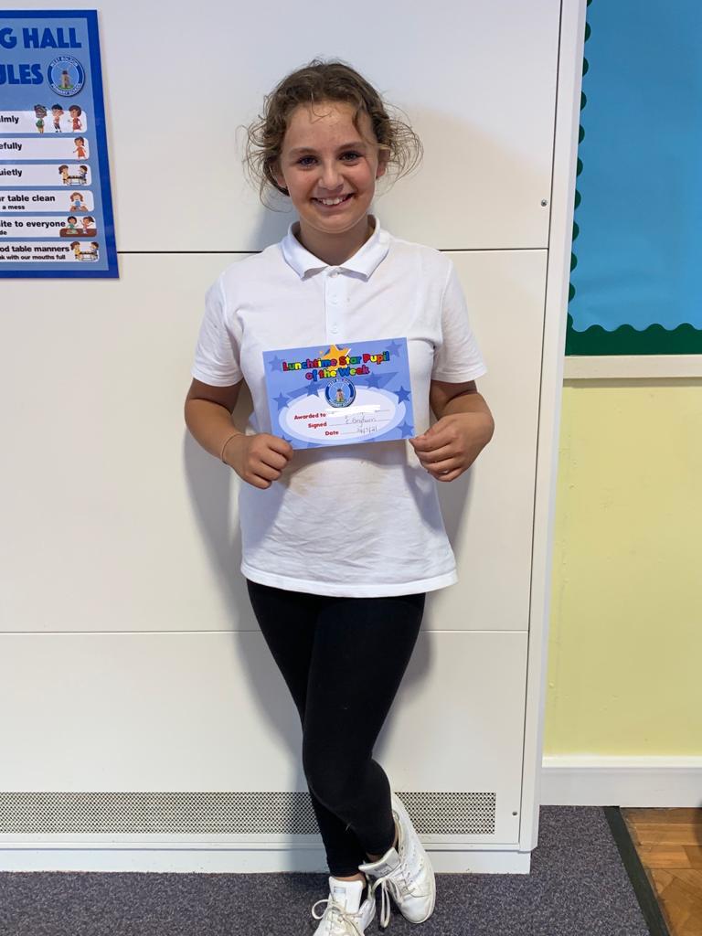 Children showing off their certificates