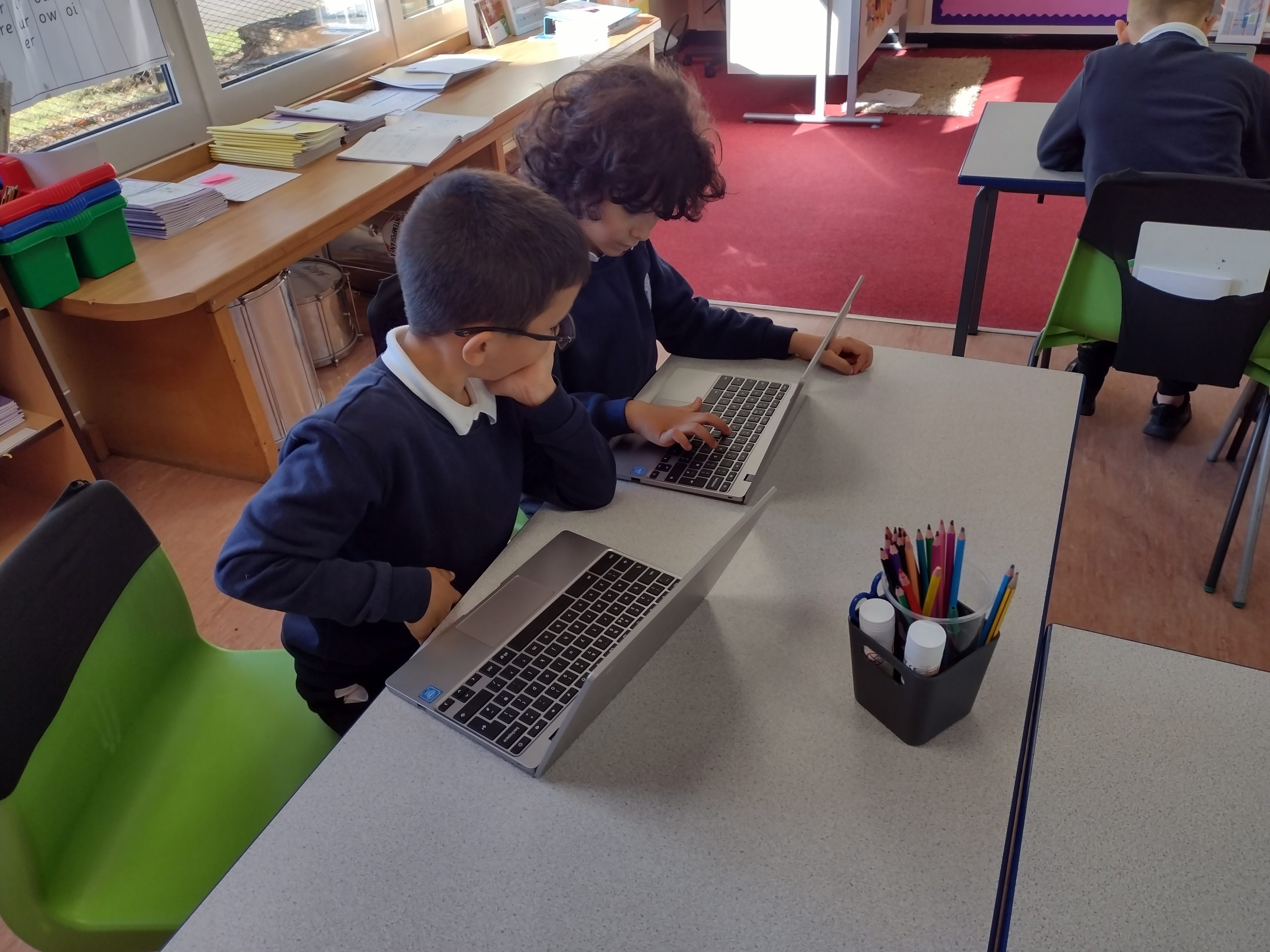 Year 3 children researching about Pixar and Dreamworks