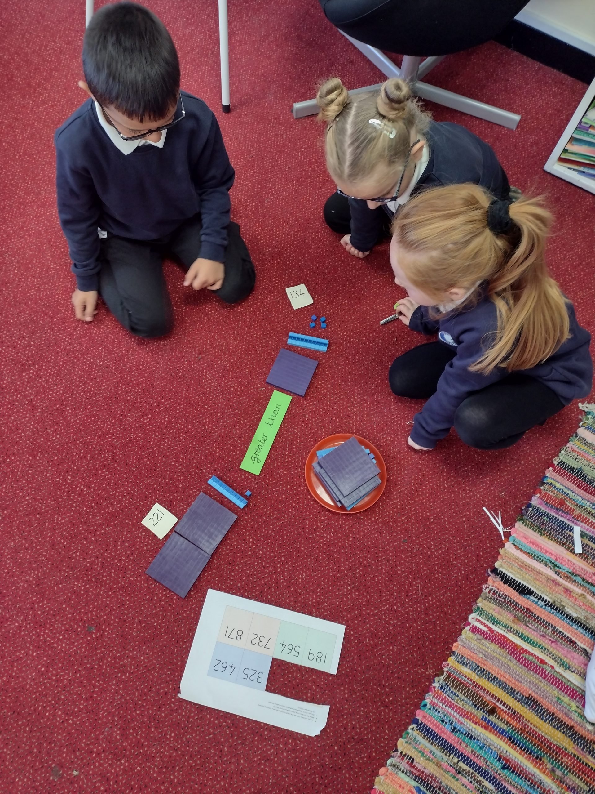 Year 3 children enjoying their practical maths lesson