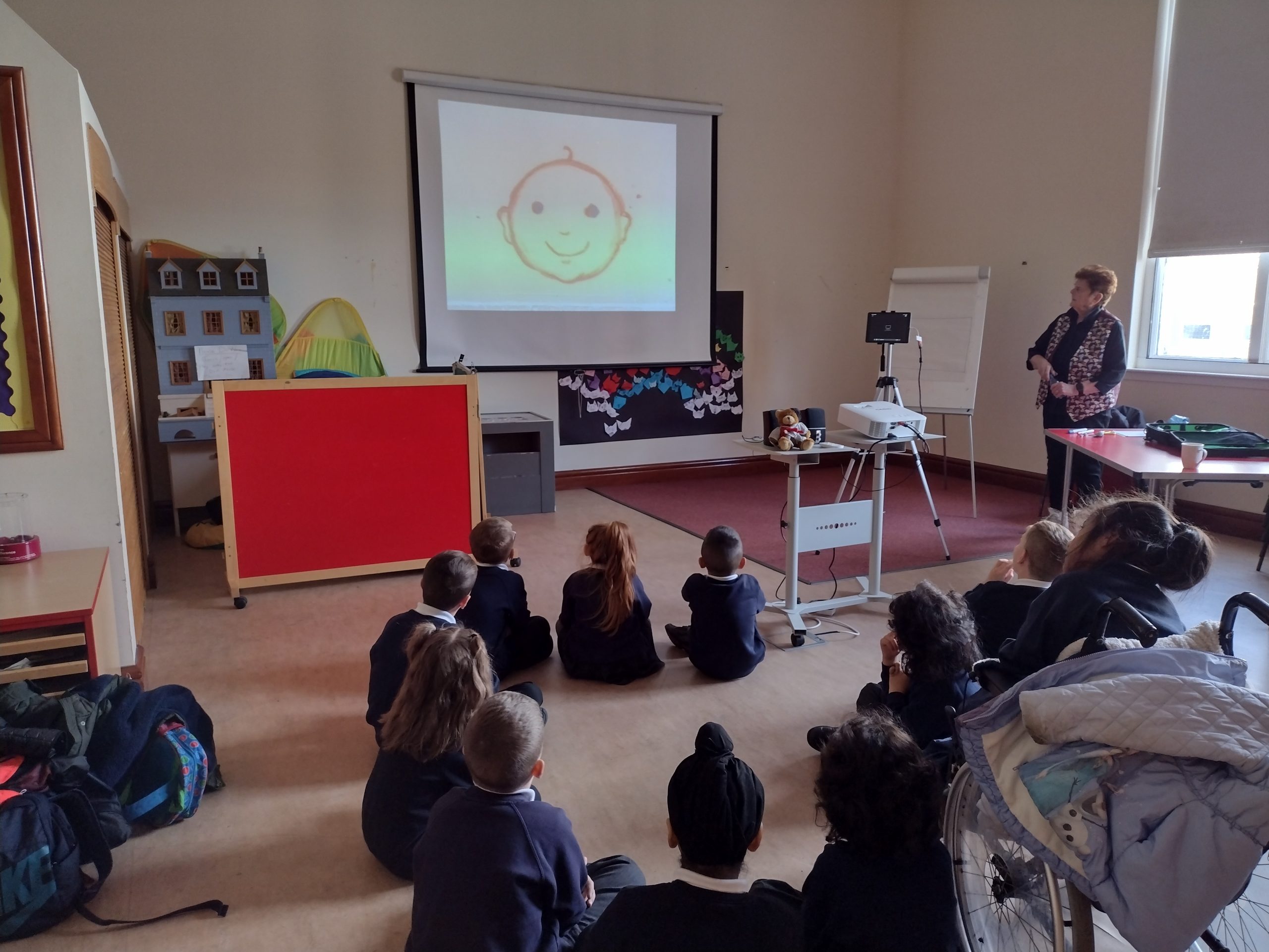 Children watching an animation by Sheila Graber