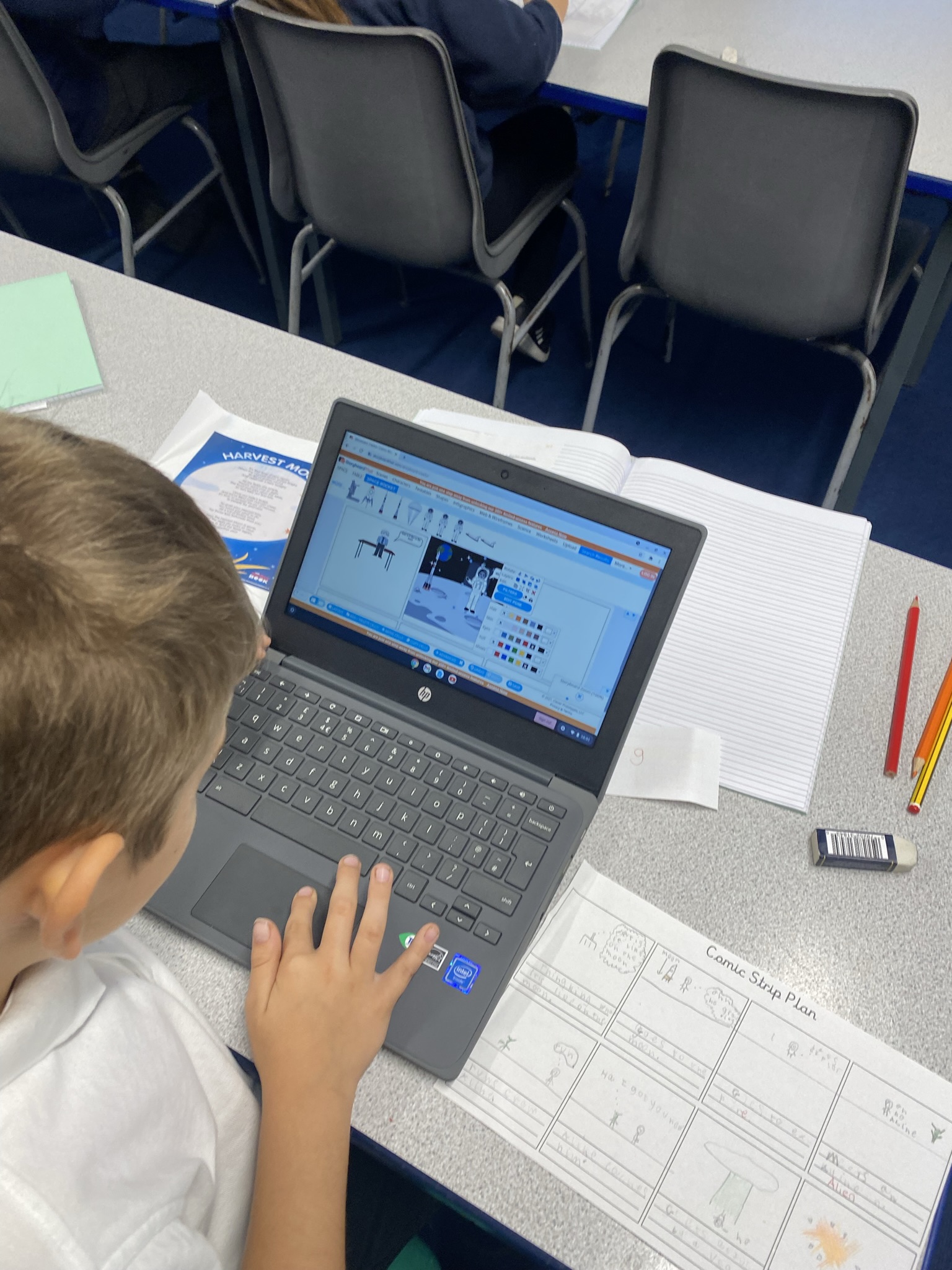 Year 5 using the chromebooks to create their own comic strips