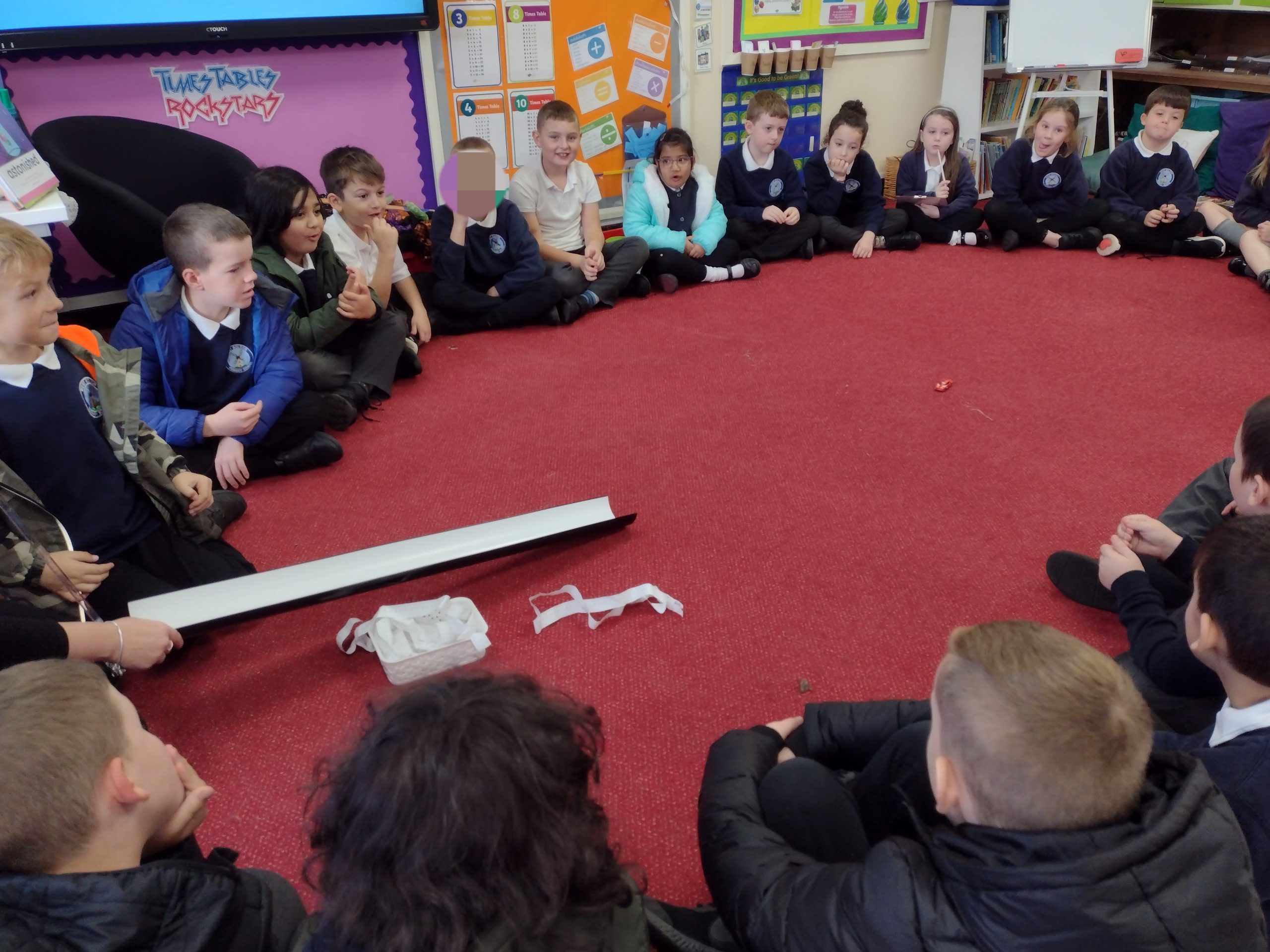 Year 3 testing the friction on the classroom carpet