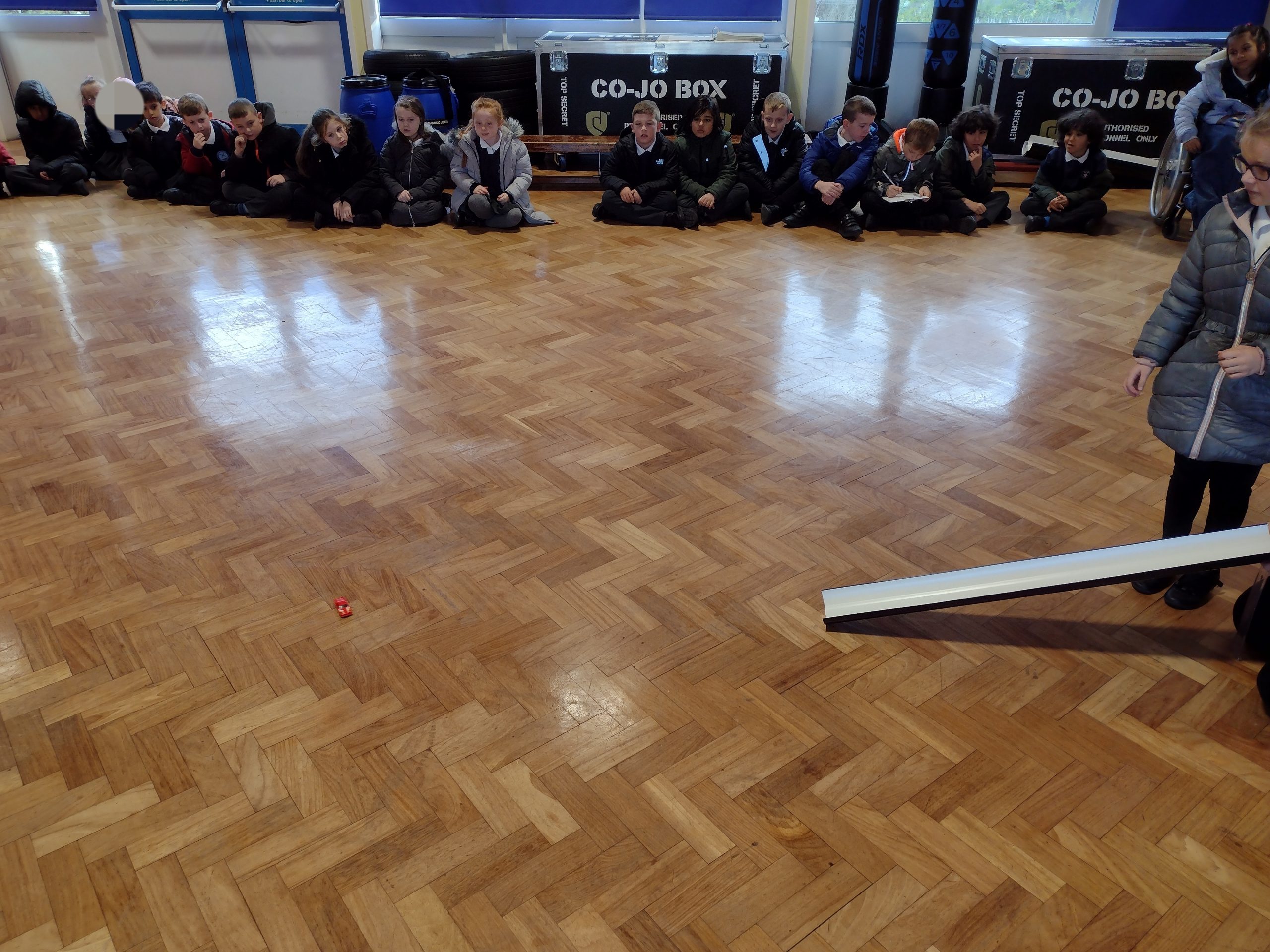 Year 3 testing the friction on the hall floor