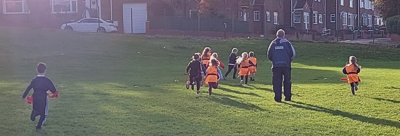 Year 2 playing rugby with John
