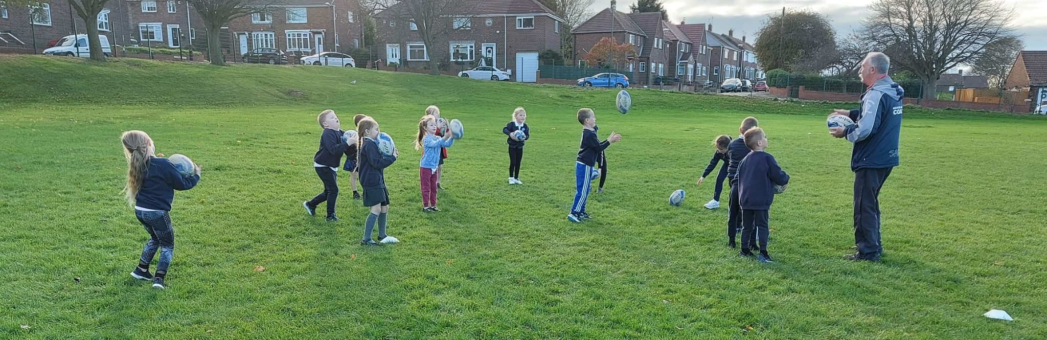 Year 2 playing rugby with John
