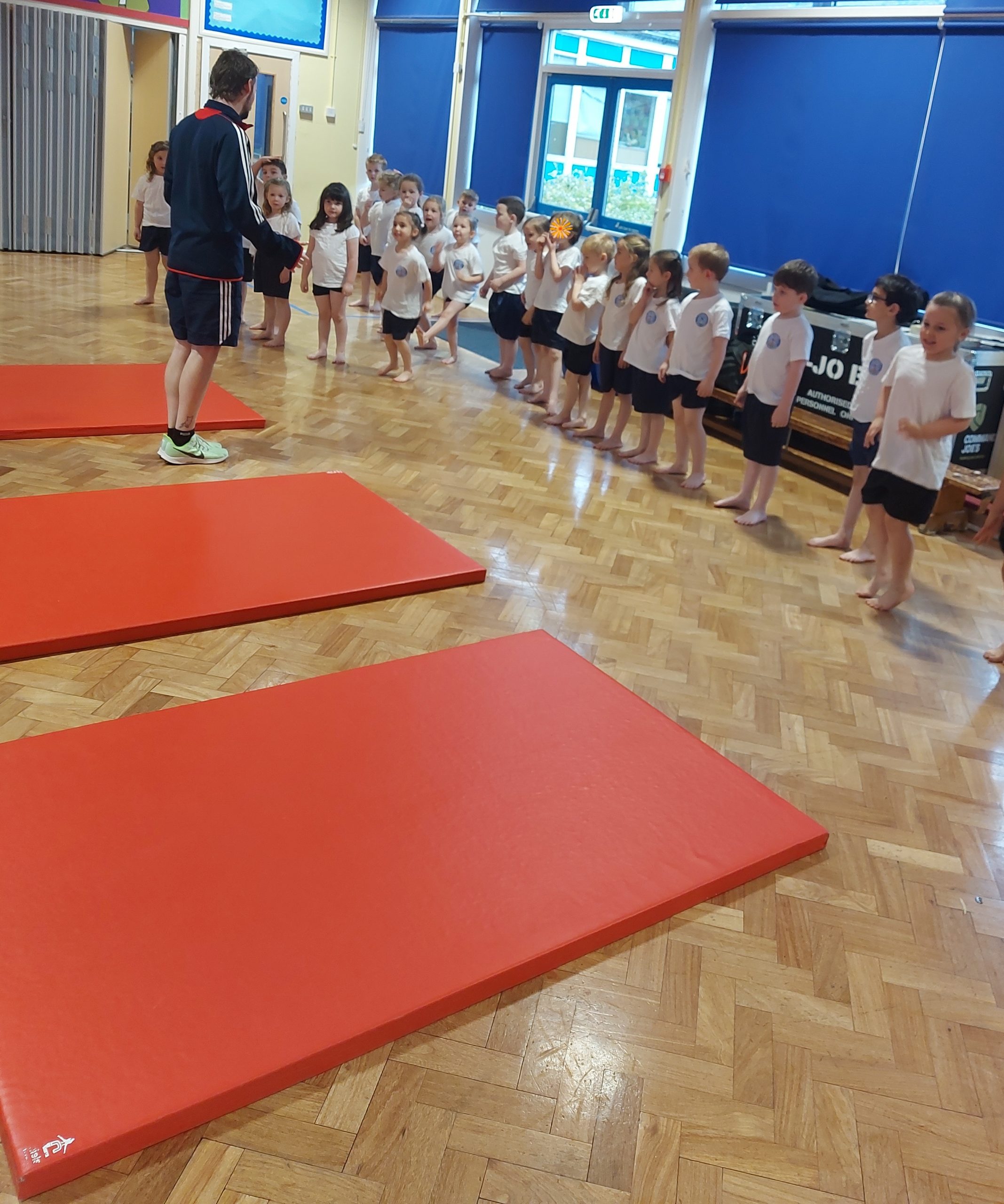 Class 3 taking part in gymnastics with Mr Gilmore
