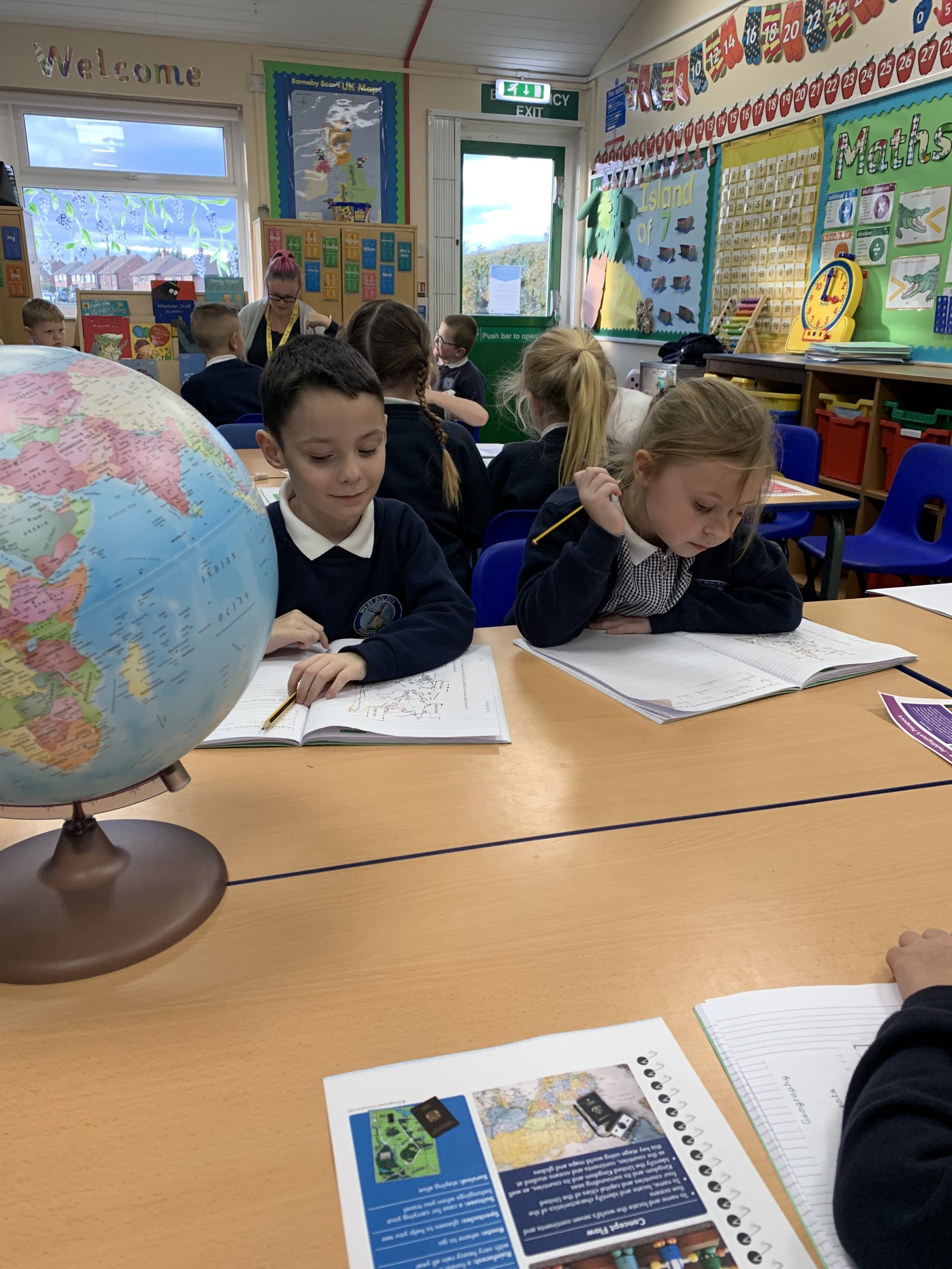 Year 2 children working on their geography