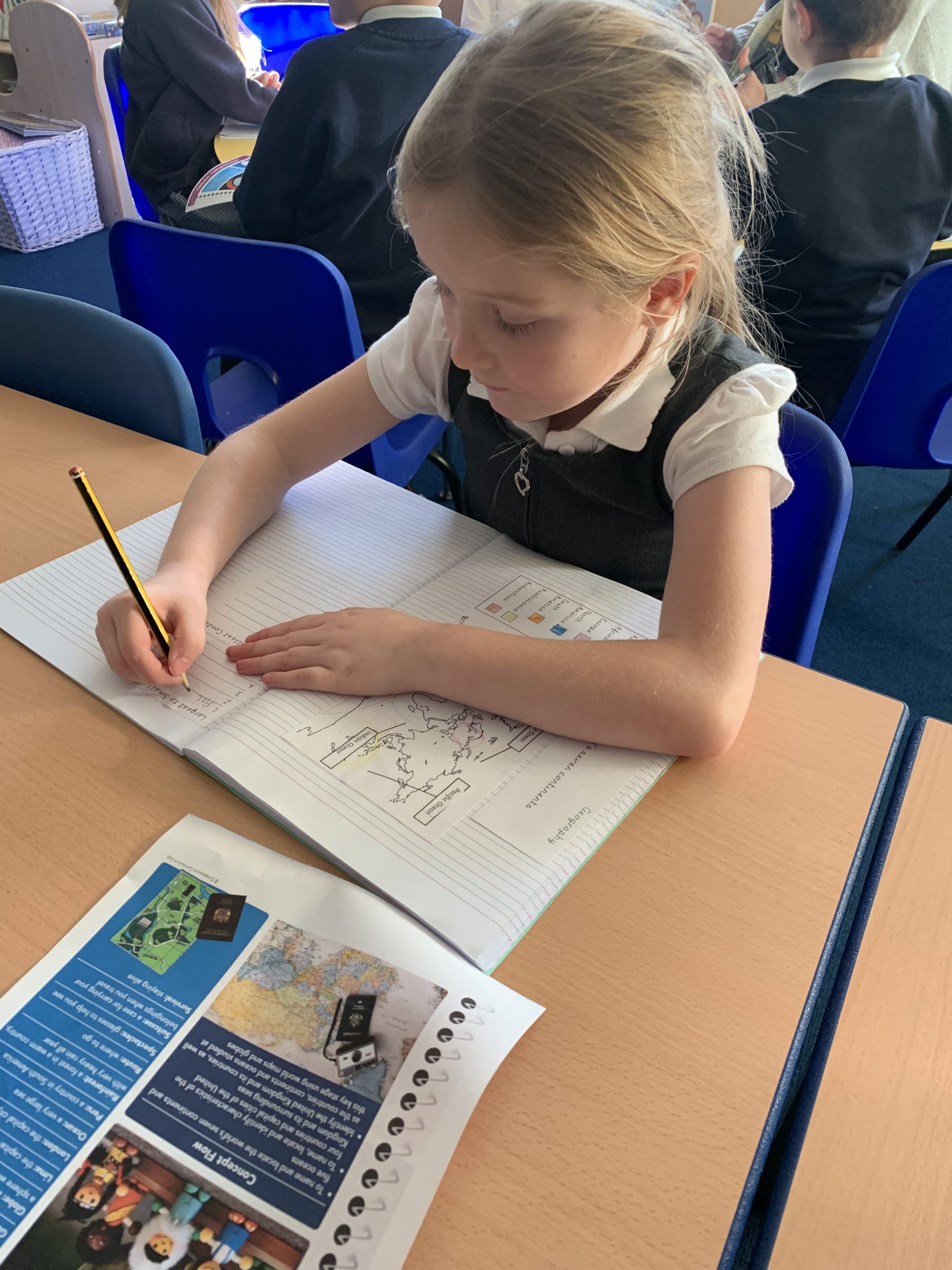 Year 2 children working on their geography