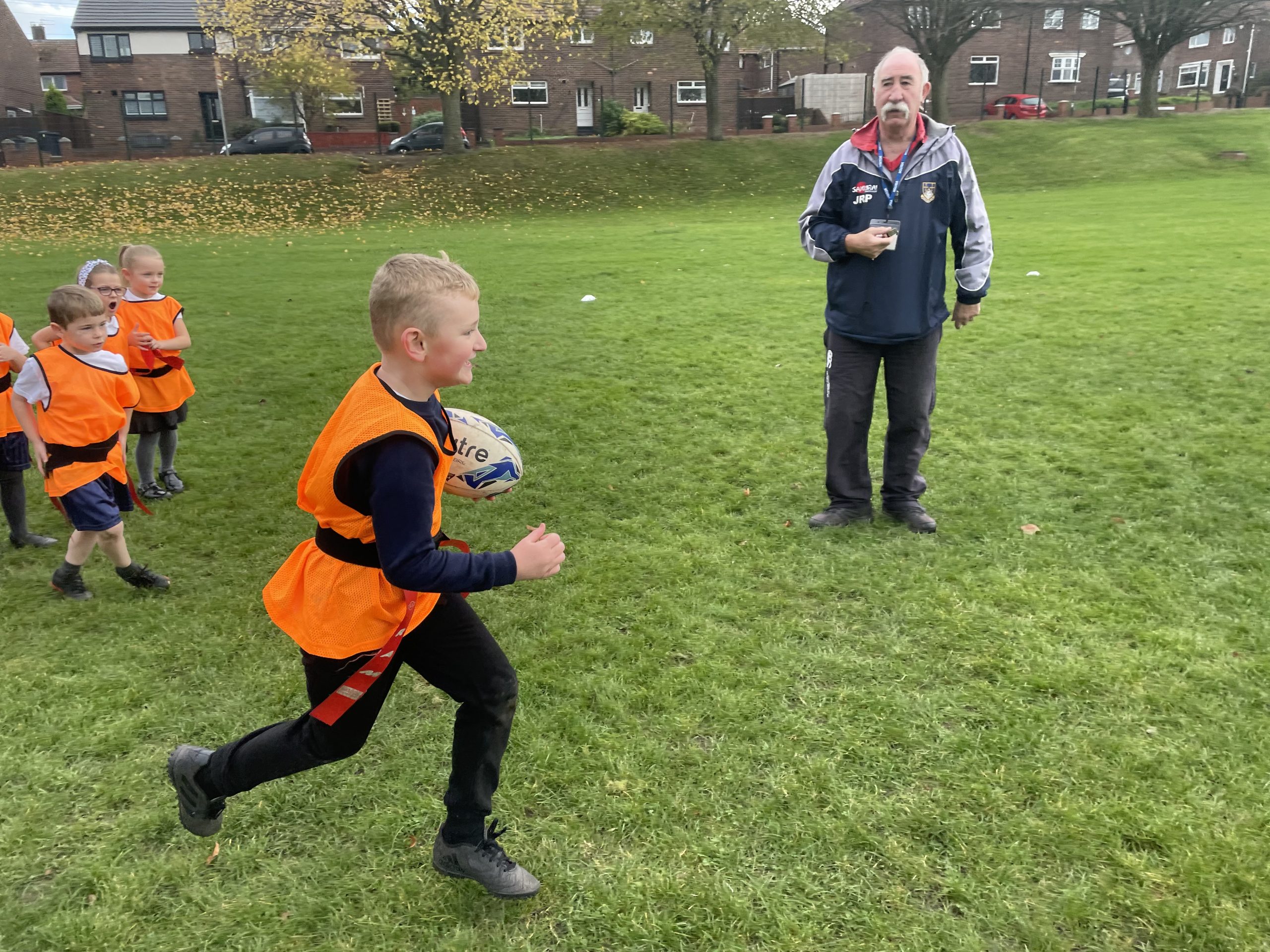 Year 2 enjoying their second rugby lesson with John