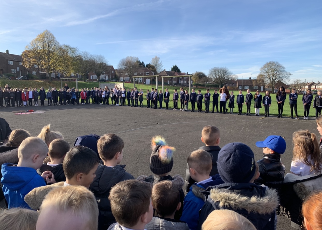 Children gathering to show their respect at 11am