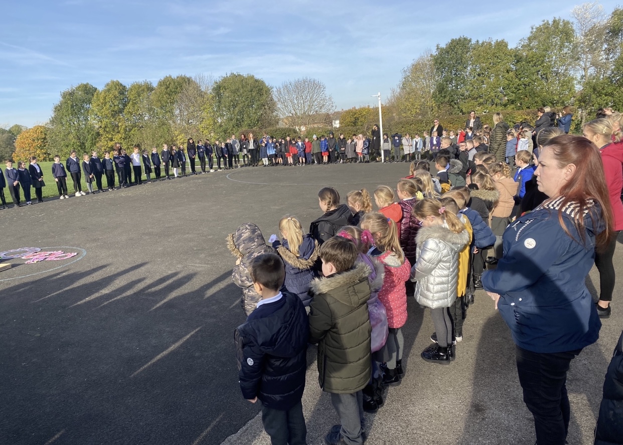 Children gathering to show their respect at 11am