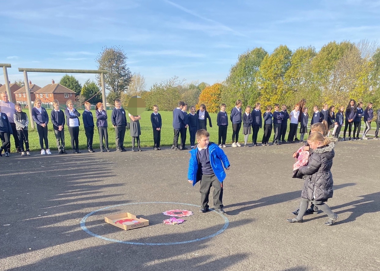 Children gathering to show their respect at 11am