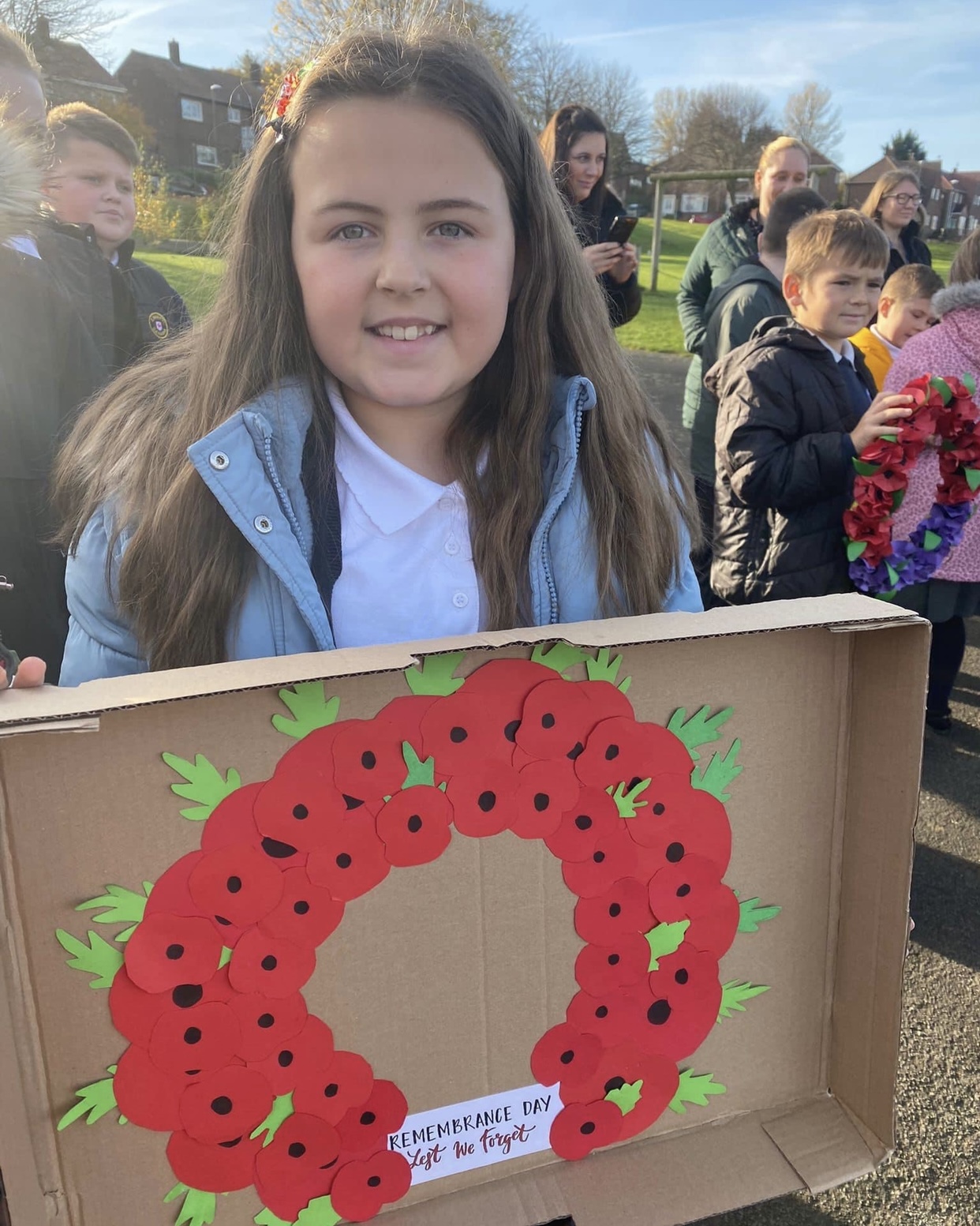 Children gathering to show their respect at 11am