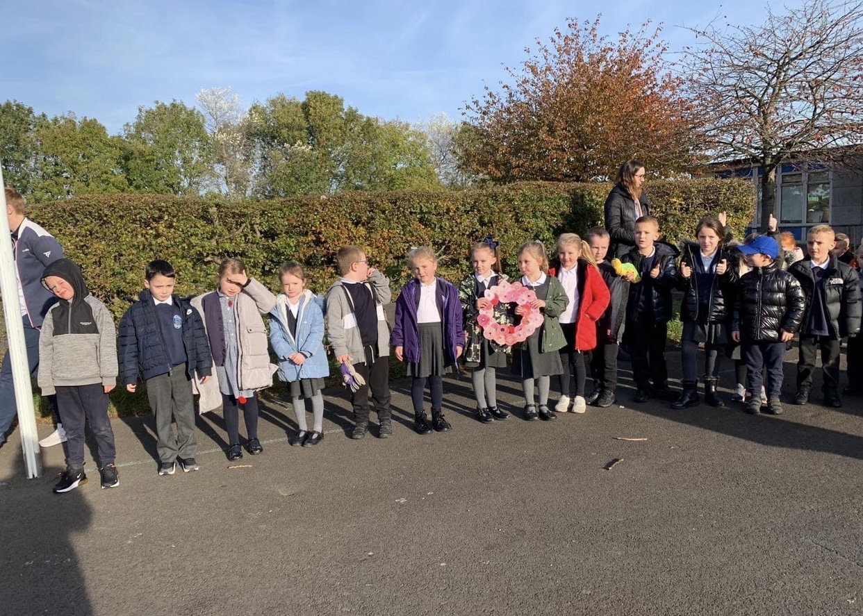 Children gathering to show their respect at 11am