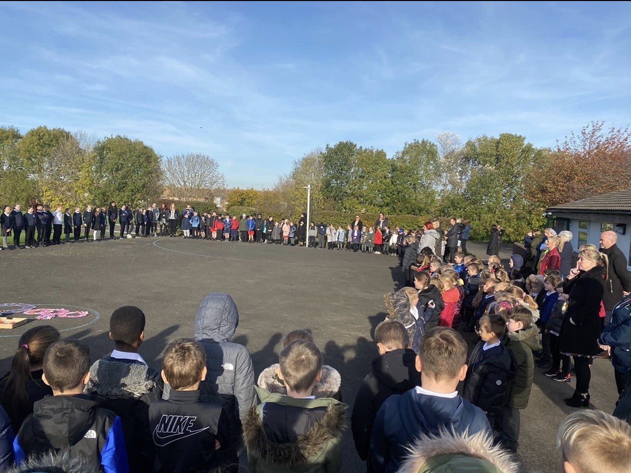 Children gathering to show their respect at 11am