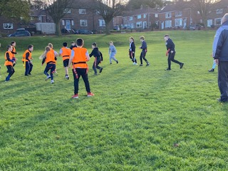 Year 6 enjoying their rugby lessons with John