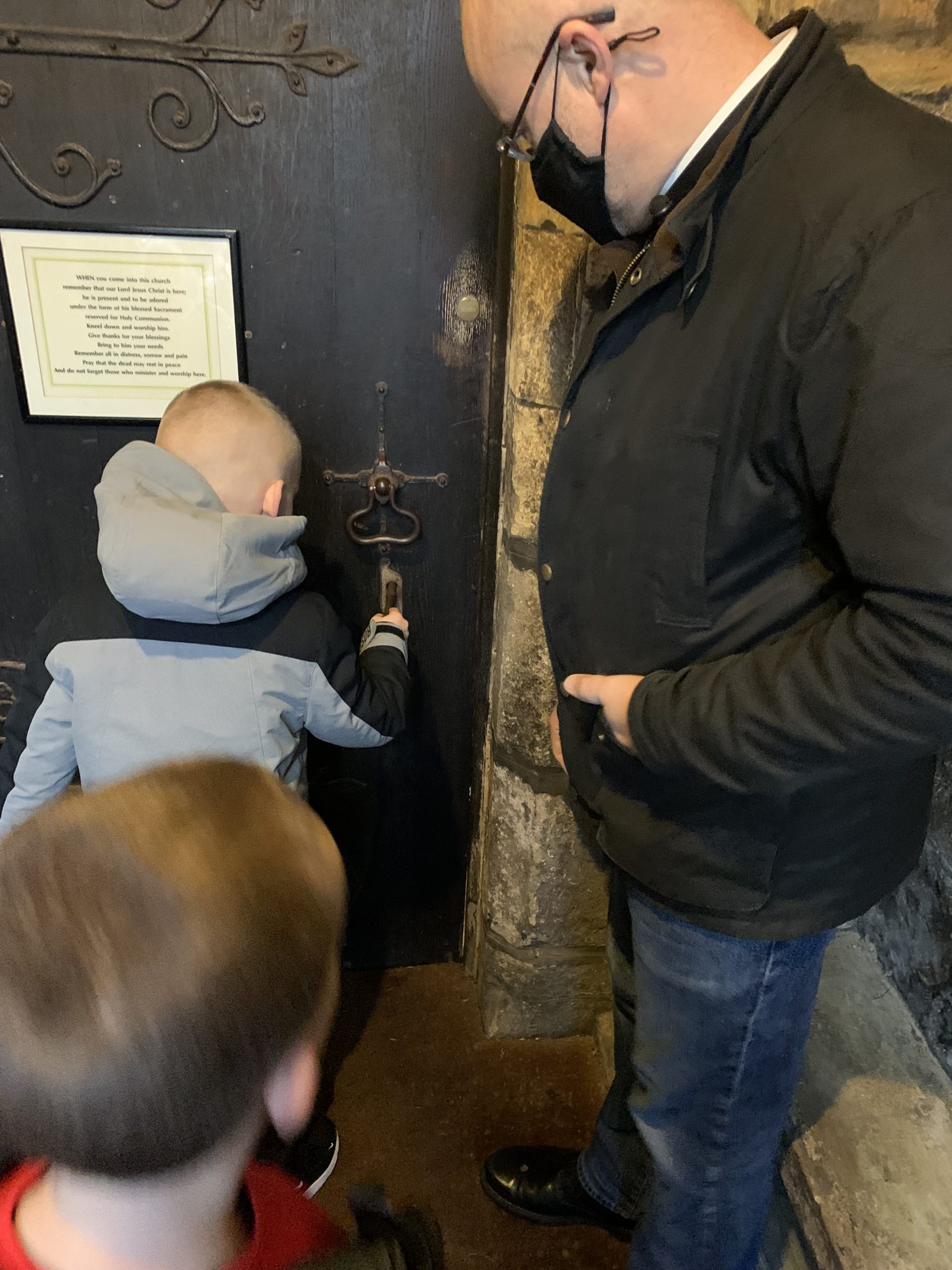 Rev Paul opening the door to the church